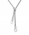 A fine line: Swarovski's linear crystal lariat necklace conveys a chic, contemporary aesthetic. Its minimal adornment--two delicate clear crystals--lets the sleek design stand out. Made in silver tone mixed metal. Approximate length: 15 inches. Approximate drop: 3 inches.