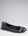 Tory Burch takes stylish cap toe flats to the next level of fashion, with bold metal bar logos defining the Pacey design.