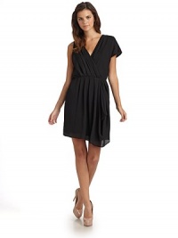 THE LOOKCrossover V-neckline Side zip closure Asymmetrical sleeves: one cap and one sleeveless Gathered lapel Gathered waist with pleats and draped detail THE FITSheath silhouette About 35 ¾ from shoulder to hemTHE MATERIALPolyesterCARE & ORIGINHand wash Made in USA