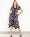 A vibrant paisley print and handkerchief hem lend an exotic look to INC's easy plus size dress.