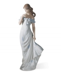 Draped in a flowing blue and white dress, this classical Lladro figurine pauses to admire a cluster of blooms amid a warm summer breeze. Draped in a flowing blue and white dress, this classical Lladro figurine pauses to admire a cluster of blooms amid a warm summer breeze.