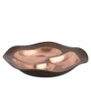 Featuring a bold new look for Nambe's signature metal, the Copper Canyon divided server captures the striking beauty of the American southwest in brilliant copper. A rippled shape inspired by the region's wind- and water-worn canyons is finished with a rustic green patina. From Nambe's collection of serveware and serving dishes.