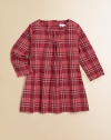 A classic check frock, delicately updated with a gathered neckline and pleated bodice.Round, gathered necklineLong sleevesBack buttons94% cotton/5% polyamide/1% elastaneDry cleanImported Please note: Number of buttons may vary depending on size ordered. 