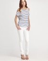 Playfully striped crewneck has open shoulders and a hi-low hem that hits below the hips. CrewneckOpen shouldersShort sleevesHi-low hem hits below the hipsRayonDry cleanImportedModel shown is 5'10 (177cm) wearing US size Small.