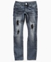 Grunge meets glam in these distressed Guess jeans styled with tears, sequins and attitude.