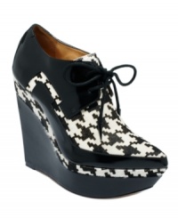All eyes will be on your when you step out in the unique Oneida platform booties by L.A.M.B. All eyes will be on your when you step out in the unique Oneida platform booties by L.A.M.B.