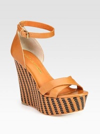 Luscious leather upper elevated by a woven wedge and platform. Self-covered wedge, 5 (125mm)Covered platform, 2 (50mm)Compares to a 3 heel (75mm)Leather upperLeather lining and solePadded insoleImportedOUR FIT MODEL RECOMMENDS ordering one half size up as this style runs small. Luscious leather upper elevated by a woven wedge and platform. Self-covered wedge, 5 (125mm)Covered platform, 2 (50mm)Compares to a 3 heel (75mm)Leather upperLeather lining and solePadded insoleImportedOUR FIT MODEL RECOMMENDS ordering one half size up as this style runs small.