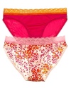 A solid or printed bikini with contrast scalloped lace trim along waistline.