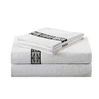 East meets west in this Chinoiserie-inspired bedding collection from Natori. The soft bamboo viscose and cotton blend jacquard is accented with a ribbon detail trim. East meets west in this Chinoiserie-inspired bedding collection from Natori. The soft bamboo viscose and cotton blend jacquard is accented with a ribbon detail trim.