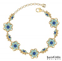Gorgeous Bracelet by Lucia Costin with Blue, Mint Blue Swarovski Crystals Surrounded by Twisted Lines and Sterling Silver Middle Flowers; 24K Yellow Gold Plated over .925 Sterling Silver; Handmade in USA Gorgeous Bracelet by Lucia Costin with Blue, Mint Blue Swarovski Crystals Surrounded by Twisted Lines and Sterling Silver Middle Flowers; 24K Yellow Gold Plated over .925 Sterling Silver; Handmade in USA