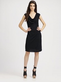 This design features an elegantly draped neckline and figure-flattering silhouette for a subtly sexy style. Draped boatneckCap sleevesElastic waistband across the backAbout 22 from natural waistModalDry cleanImportedModel shown is 5'10 (177cm) wearing US size Small. This design features an elegantly draped neckline and figure-flattering silhouette for a subtly sexy style. Draped boatneckCap sleevesElastic waistband across the backAbout 22 from natural waistModalDry cleanImportedModel shown is 5'10 (177cm) wearing US size Small.