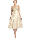 Tonal sequins shine on the bodice of this exceptionally chic tea length style with a delicate sash cinching the waist.Spaghetti straps Tonal sequined bodice Interior bra cups Tie-sash waist Back zipper Pleated organza skirt Fully lined About 47 from shoulder to hem Polyester Spot clean Imported