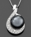 Dance to your own tune. This illuminating pendant features a cultured Tahitian pearl (9mm) and round-cut diamonds (1/10 ct. t.w.) set in 14k white gold. Approximate length: 18 inches. Approximate drop: 3/4 inch.