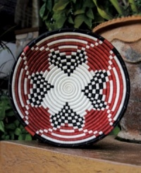 Rwandan women pour heart and soul into the Urukundo fruit bowl, a basket made with and symbolic of love. Hanging on a wall or topping a coffee table, the hand-woven red, black and white pattern makes a bold, meaningful statement. Rwandan women pour heart and soul into the Urukundo fruit bowl, a basket made with and symbolic of love. Hanging on a wall or topping a coffee table, the hand-woven red, black and white pattern makes a bold, meaningful statement.