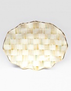 This remarkably unique platter, in hand-painted terra cotta with color-dragged checks and golden trim, creates an ultra-glamorous presentation piece for your guests.Ceramic with golden lustre16 X 22Hand washMade in the USA