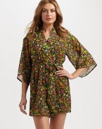 A semi-sheer wrap imparts thoughts of spring with a lush floral print. Three-quarter sleevesSelf-tie waistAbout 35 from shoulder to hemPolyesterMachine washImported