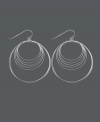 Get style that's out of this orbit! Chic, circular earrings by Unwritten feature a wire wrap design crafted in sterling silver. Approximate drop: 2-1/4 inches.