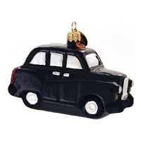 This glass British Taxi ornament is modeled after the traditional taxi: rounded and offering enough room inside for 4 adults, two cellos and tea. This glass British Taxi ornament is modeled after the traditional taxi: rounded and offering enough room inside for 4 adults, two cellos and tea.