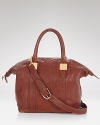 Gleaming gold hardware adds a city sleek touch to this slouchy leather tote from Rachel Zoe.