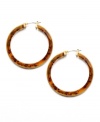 Add exotic flair with non-traditional hoops! Lauren by Ralph Lauren's unique style highlights large resin hoops in a chic tortoise shell color. Set in gold tone mixed metal. Approximate diameter: 1-1/2 inches.
