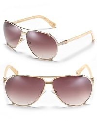 Hit the streets in chic aviator sunglasses by Dior. Hit the streets in chic aviator sunglasses by Dior.
