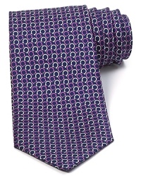 Repeating Gancini logos are rendered in two complementary colors and patterned with a whimsical design on this superior silk tie, offering a bit of refined luxury for the modern man. Repeating Gancini logos are rendered in two complementary colors and patterned with a whimsical design on this superior silk tie, offering a bit of refined luxury for the modern man.