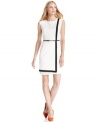 A solid band of contrasting trim highlights the sleek structure of Calvin Klein's new faux-wrap dress.