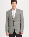 A smartly checked houndstooth pattern dresses up this impeccably tailored piece.Notched lapelButton frontFlap pocketsButton cuffsFully linedAbout 31 from shoulder to hem98% wool/2% lycraDry cleanImported