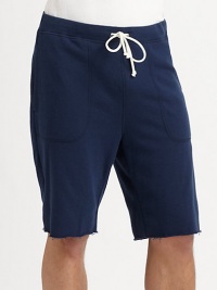 Sporty, cotton-rich design with drawstring waistband and frayed hem for laid-back style.Drawstring, elasticized waistbandSlash pocketsFrayed hemInseam, about 1090% cotton/10% NylonMachine washMade in the USA of imported fabric Sporty, cotton-rich design with drawstring waistband and frayed hem for laid-back style.Drawstring, elasticized waistbandSlash pocketsFrayed hemInseam, about 1090% cotton/10% NylonMachine washMade in the USA of imported fabric