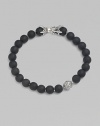 A striking collection of onyx beads are laced alongside a sterling silver accent and matching closure. From the Spiritual Bead Collection 8mm onyx beads Sterling silver Bracelet length, about 8½ Sterling silver clasp Imported 