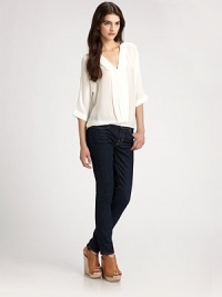 Fine, lustrous silk, tailored in a billowing silhouette with elegant pleats down the front.Stand collar V neckline Blouson sleeves with cuffs Gathered hem Silk; dry clean Imported Fine, lustrous silk, tailored in a billowing silhouette with elegant pleats down the front.Stand collar V neckline Blouson sleeves with cuffs Gathered hem Silk; dry clean Imported
