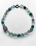 A colorful strand of flourite beads accented with a amethyst encrusted bead. AmethystMulti-colored flouriteRhodium-plated sterling silverLength, about 18Spring ring closureImported 