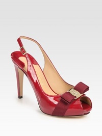 Glassy patent leather in a traditional peep toe silhouette with a grosgrain gibbon bow, adjustable slingback strap and designer nameplate at the toe. Self-covered heel, 4 (100mm)Covered platform, 1 (25mm)Compares to a 3 heel (75mm)Patent leather and grosgrain ribbon upperLeather lining and solePadded insoleMade in ItalyOUR FIT MODEL RECOMMENDS ordering one size up as this style runs small. 