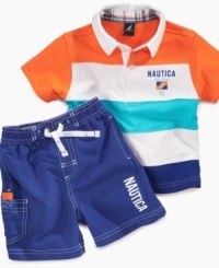 Sail on through in style. He'll get through the day comfortably in this cute polo and swim trunk set from Nautica. Sail on through in style. He'll get through the day comfortably in this cute polo and swim trunk set from Nautica.