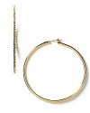 Lauren Ralph Lauren classic large hoop earrings are outlined with sparkling crystal accents. Snap post backing. Approx. 2 D.