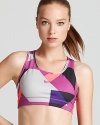 Give your workout wardrobe a jolt of graphic print in this Nike bra, made with Nike's Dri-FIT technology to wick away moisture.