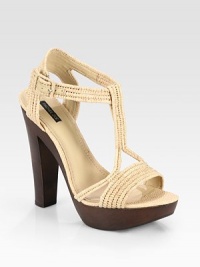 Wondrously woven raffia t-strap design with an adjustable ankle strap and wooden heel. Wooden heel, 5½ (140mm)Wooden platform, 1 (125mm)Compares to a 4½ heel (115mm)Raffia upperLeather liningRubber solePadded insoleImportedOUR FIT MODEL RECOMMENDS ordering one half size down as this style runs large. Wondrously woven raffia t-strap design with an adjustable ankle strap and wooden heel. Wooden heel, 5½ (140mm)Wooden platform, 1 (125mm)Compares to a 4½ heel (115mm)Raffia upperLeather liningRubber solePadded insoleImportedOUR FIT MODEL RECOMMENDS ordering one half size down as this style runs large.