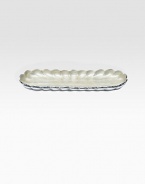 A unique addition to any home, handcrafted in an oblong shape from fluted metal with opalescent, crushed mother-of-pearl enamel. Food safe Engraved signature 14W X 1H X 5D Hand wash Imported 