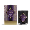 Packaged in a foil-embellished gift box, Fringe Alchemy's currant & cassis-scented candle cuts an imposing figure in chic black and regal purple.