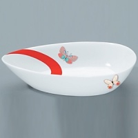 For over two centuries Raynaud has created unique Limoges porcelain, with a marked preference for relief shapes and generously colored and gilt decorations. Metamorphoses is a striking pattern of red and gold with a butterfly motif.