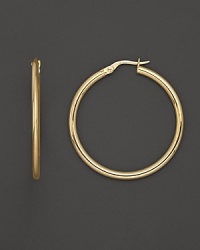 Bold, gleaming gold hoops make a sophisticated statement. Bold, gleaming gold hoops make a sophisticated statement.