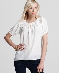 Elevate your favorite jeans with this little white top from Joie that's anything but basic. Elevate your favorite jeans with this little white top from Joie that's anything but basic.