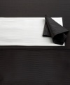 Made for celebration, the Cheers Twist tablecloth by Mikasa sets the scene with an understated linear pattern and dressy sheen in versatile black or white. Machine washable table linens make for an especially happy host, too. (Clearance)