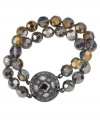Shimmering and stylish. With a metallic finish featuring both gold and silver, Carolee's double-row bracelet is easy to mix and match within your wardrobe. Set in hematite tone mixed metal, it's embellished with glass beads. Approximate length: 7-1/2 inches.