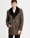 Handsome wool tweed is impeccably tailored in a sleek, double-breasted silhouette, finished with ample front pockets and a back vent.Button frontChest welt pocketWaist flap pocketsRear ventAbout 33 from shoulder to hemWool/nylon/mohair/alpacaDry cleanImported