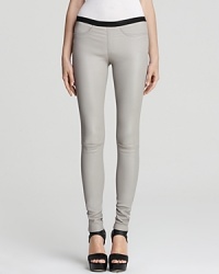 These supple Helmut Lang leggings are the season's it piece--lush and luxurious in lamb leather and oh-so sleek in an über-skinny silhouette. Keep the look relaxed and pair them with a tee or opt for a silk top and work it to the max. These supple Helmut Lang leggings are the season's it piece--lush and luxurious in lamb leather and oh-so sleek in an über-skinny silhouette. Keep the look relaxed and pair them with a tee or opt for a silk top and work it to the max.