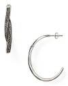 Judith Jack shapes up with this pair of sterling silver hoop earrings. Dipped in marcasite stones, this style flaunts an eye-catching design with sophisticated sparkle.