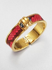 Edgy and exotic, this design is centered with a strip of vivid pink python, the bold polished cuff linked with domes of hematite.HematitePythonGoldplated brassDiameter, about 2.5Width, about 1Hinged and claspedMade in USA Edgy and exotic, this design is centered with a strip of vivid pink python, the bold polished cuff linked with domes of hematite.HematitePythonGoldplated brassDiameter, about 2.5Width, about 1Hinged and claspedMade in USA
