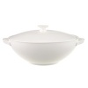 Anmut will be the choice for purists; it is an undecorated white that beautifully shows off the glamorous forms and quality bone china. Dishwasher and microwave safe. Accessories shown: oval platter, round vegetable bowl, creamer, sugar bowl.