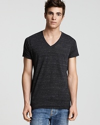 Regular fit eco-heather short-sleeve v-neck tee crafted in Eco-Heather, a uniquely imperfect blend of organic cotton, recycled polyester and naturally-occurring rayon. Regular fit eco-heather short-sleeve v-neck tee crafted in Eco-Heather, a uniquely imperfect blend of organic cotton, recycled polyester and naturally-occurring rayon.